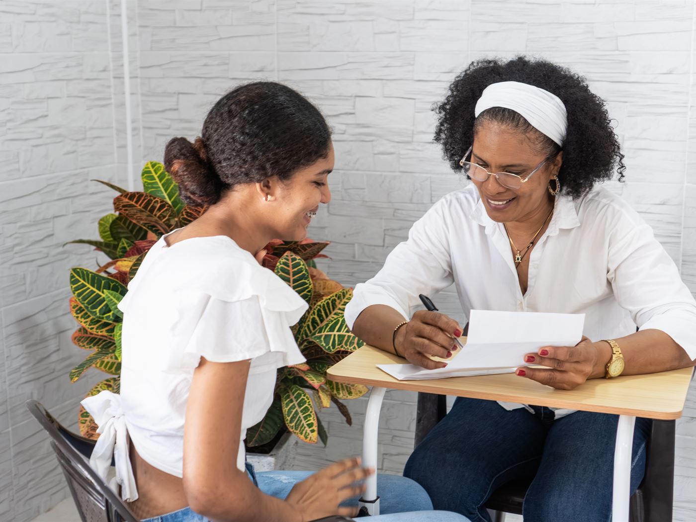 Case worker reviewing paperwork with a client