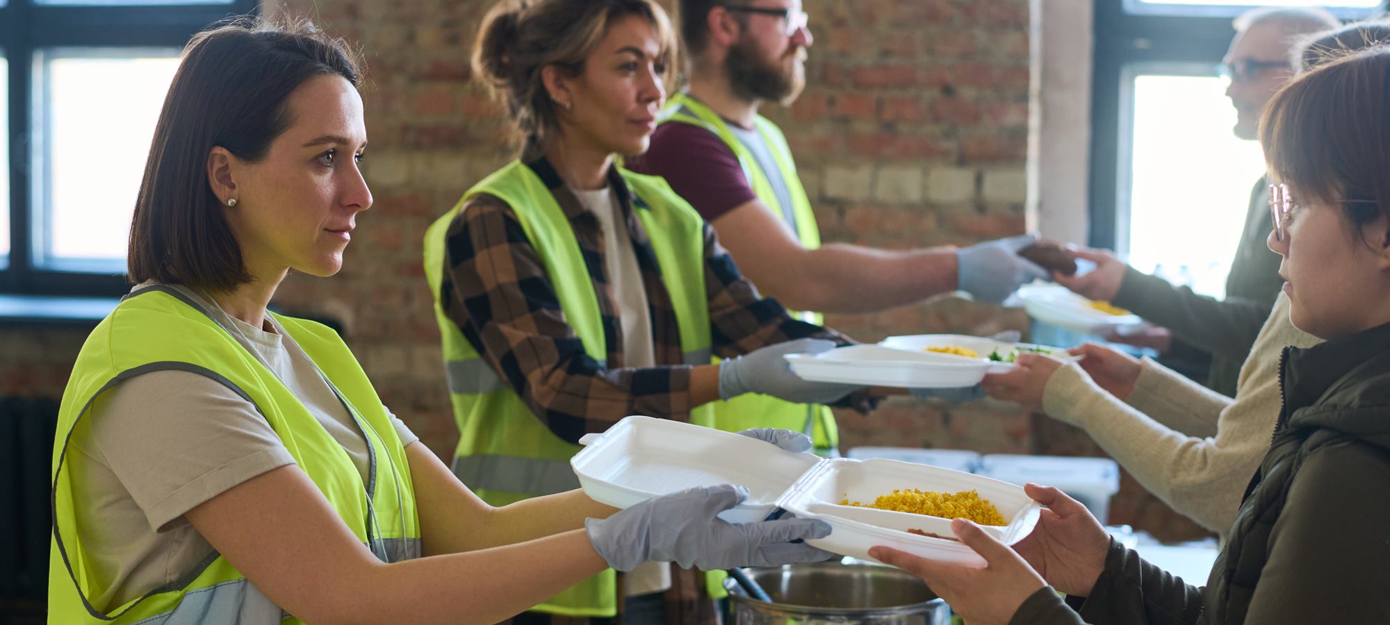 Volunteers serving meals