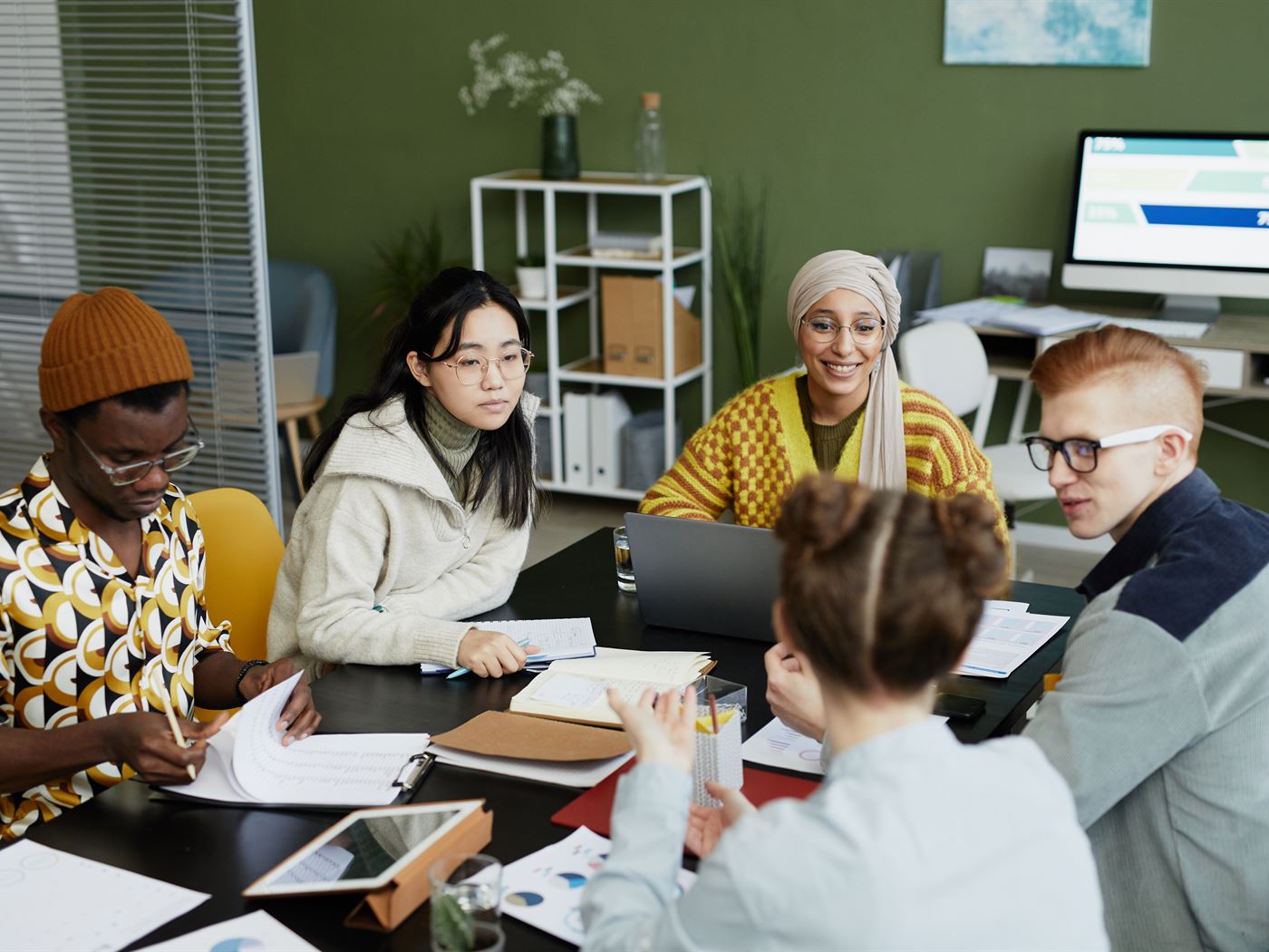 A small team working together around a table